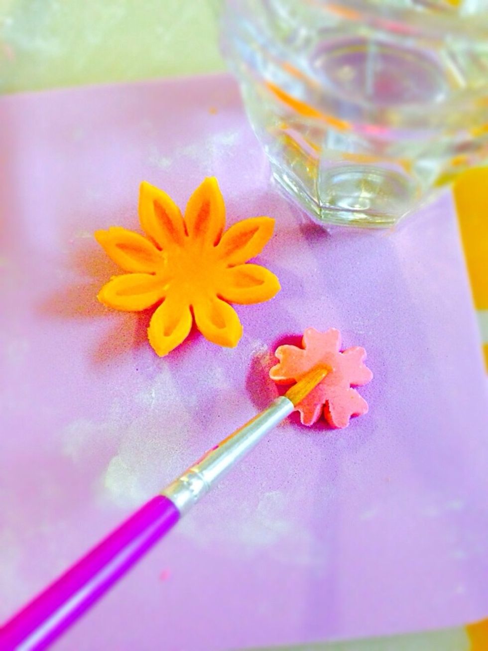 For more advance look pair two different color flowers (large on the bottom and small on top. Glue together with water (brush it carefully do not over moist them)