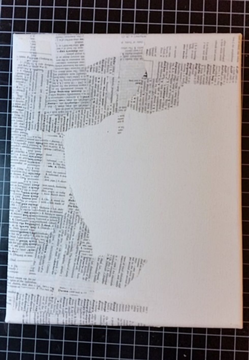 For my first layer I attached a bit of torn dictionary pages using a gel medium.