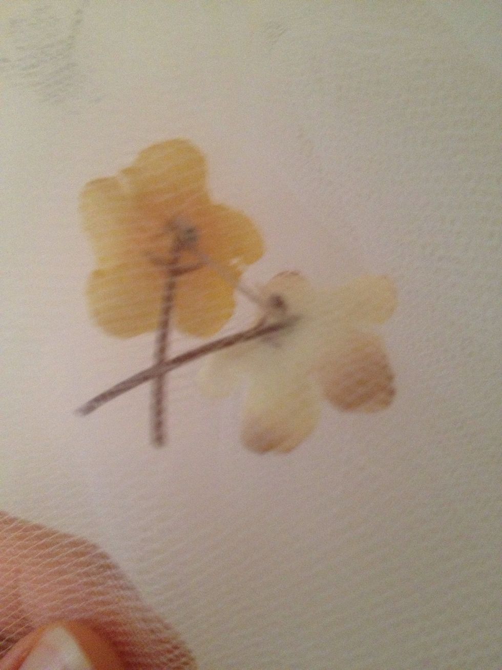 For smaller ones, do simple stitches thru the center of the flower.
