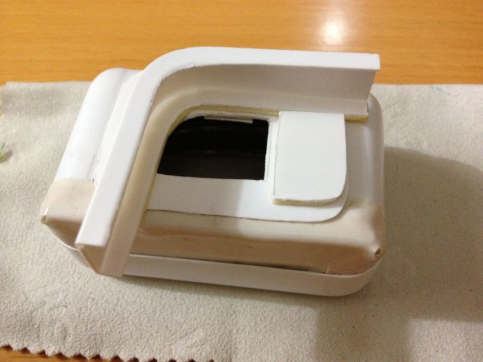 For the back, cut a hole in the cover so that it doesn't cover the phone camera. Make sure there's space to stick the mount on. There're many ways to make the mounting part but I used iPad box insert.