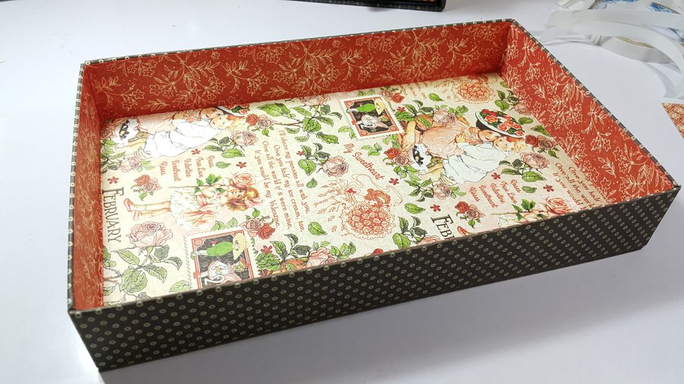 For the basement drawer, cover the outside with pattern papers of 2pcs 2-1/2"x11-1/2" and 2pcs of 6-1/2"x2-1/2", then cover the inside with the same sizes of the chipboards.