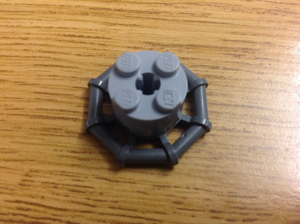 For the body, take a round 2x2 and a spiderweb thing.