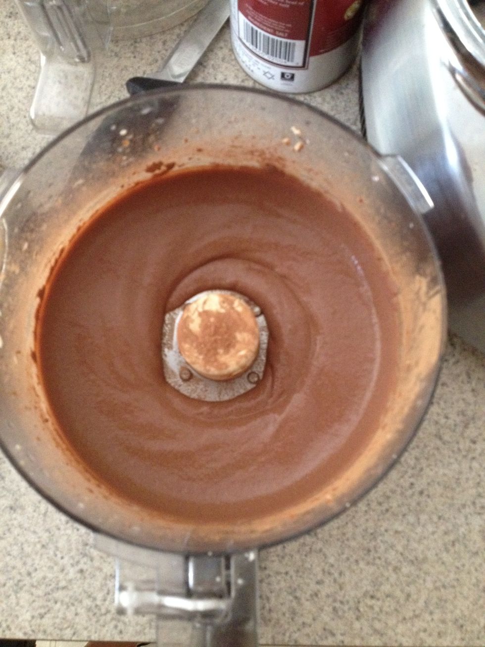 For the chocolate layer - place 1 block of silken tofu, cocoa powder, milk, syrup, vanilla extract and salt into the food processor. Add more milk if it isn't smooth enough. It should look like this.