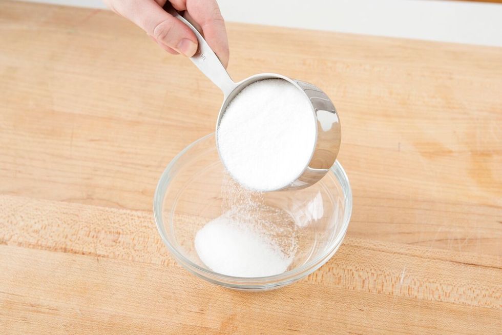 For the cinnamon sugar topping, add 1/2 cup of sugar to a small bowl.