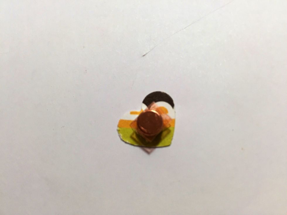 For the "clasp" of the purse, I use a small magnet and cover it with a small heart and fasten it with strong red tape adhesive on the inside flap of the paper. You need 2