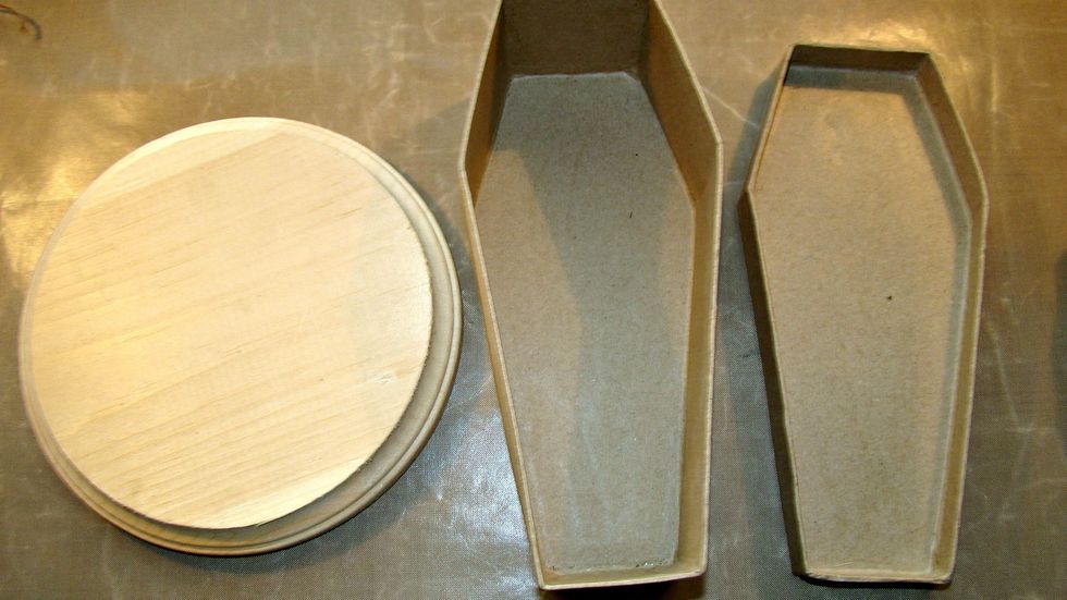 For the coffin I wanted it to be held together with a base. I purchased this wood piece at the craft store for $2.99 and the coffin was from the dollar store.