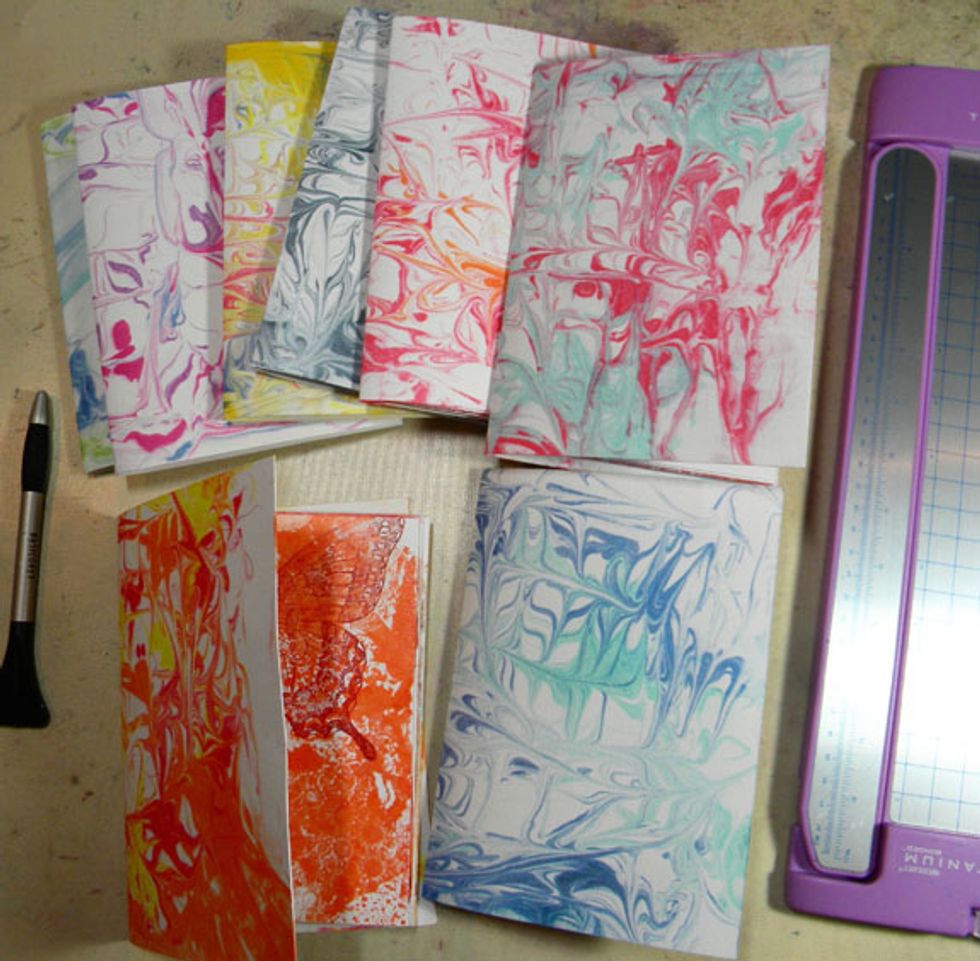 For the covers, I used the marbling technique that I demonstrated in my last blog post when I created the Happy New Year sign. I used mixed media paper, which is more sturdy.