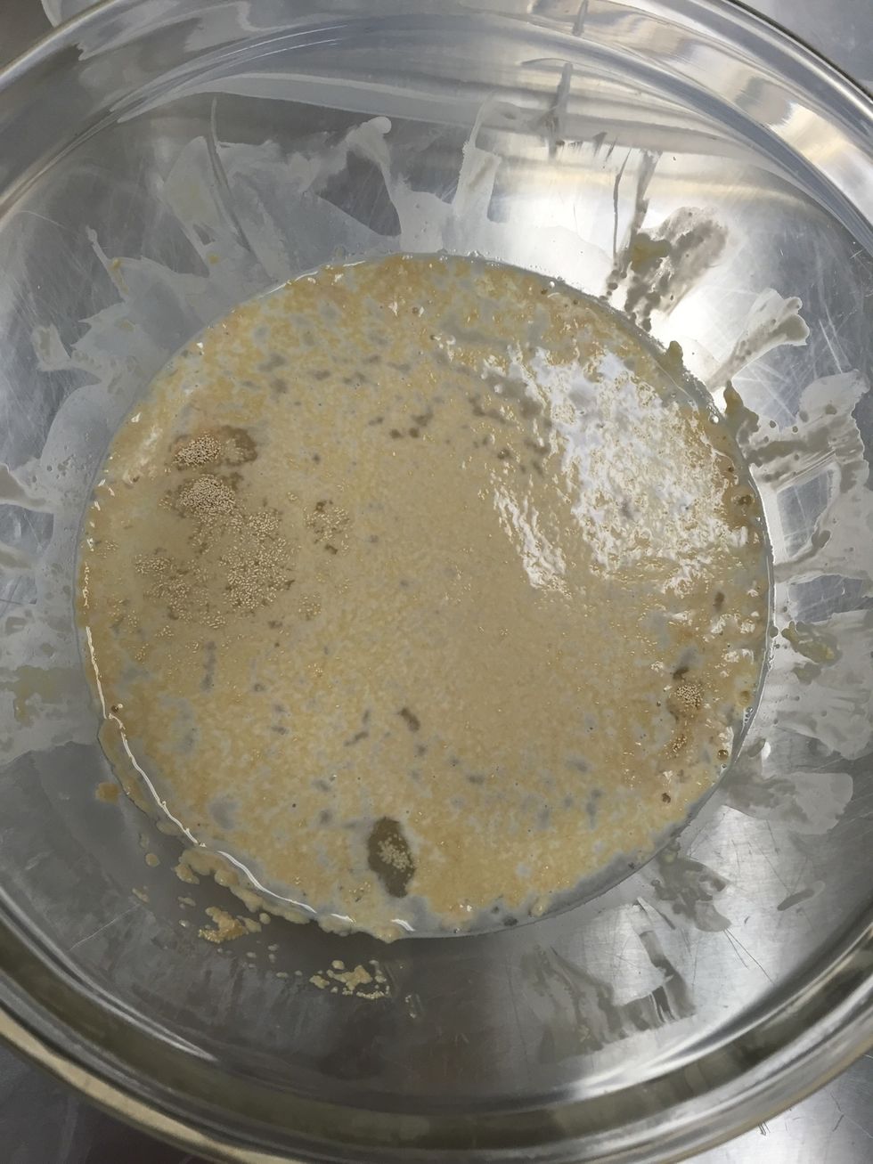For the dough, dissolve the one package of yeast into the one cup of 110-115 degree Fahrenheit water.