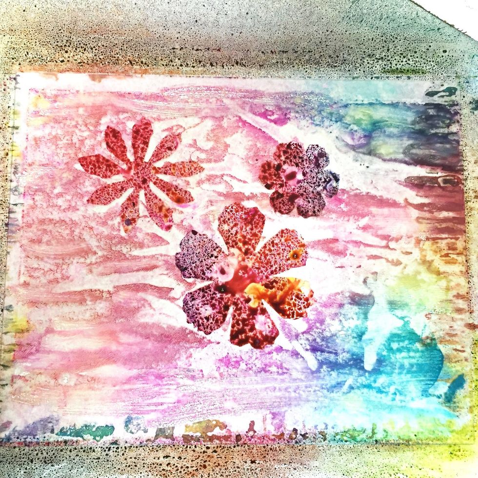 for the final print. i added the diecut flowers back to the uncleaned plate - there was still some ink and paint remaining on it, and the flowers had inks on them from previous print as well.