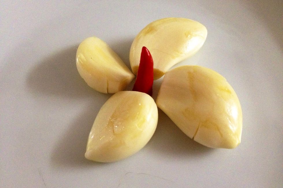 For the final saut\u00e9, get 4 cloves garlic and hot cherry peppers. Alternatively, I used 1 small chilli (I don't want it too hot).