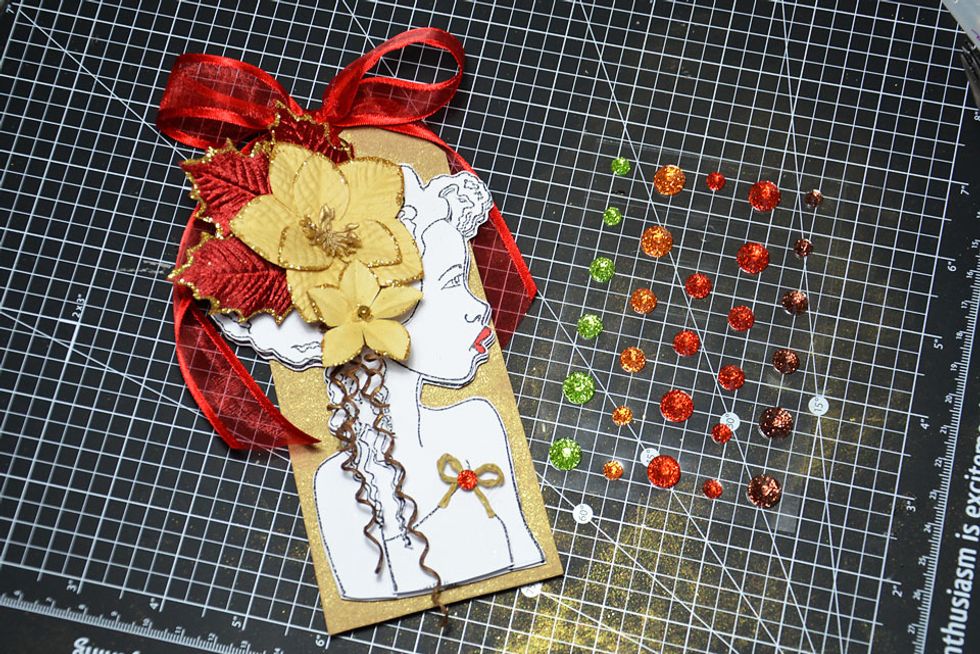 For the final touch add a red crystal to the bow centre.