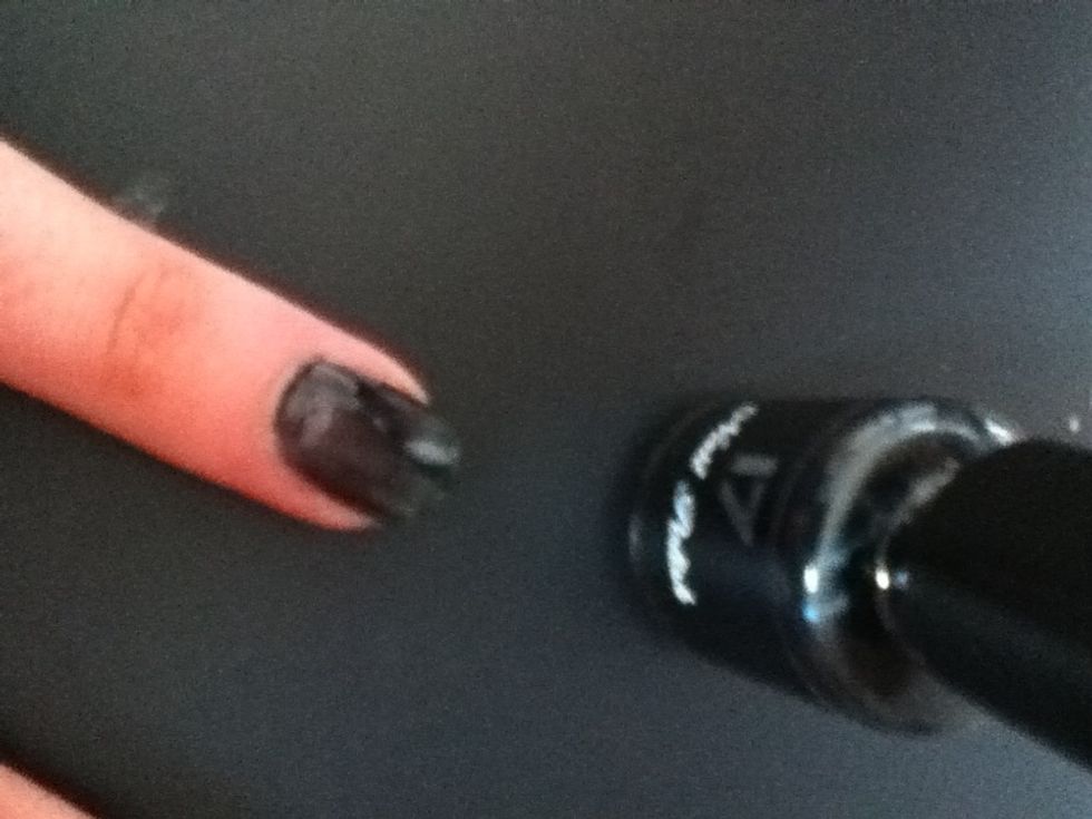 For the first design, paint your nails black and leave them to dry.