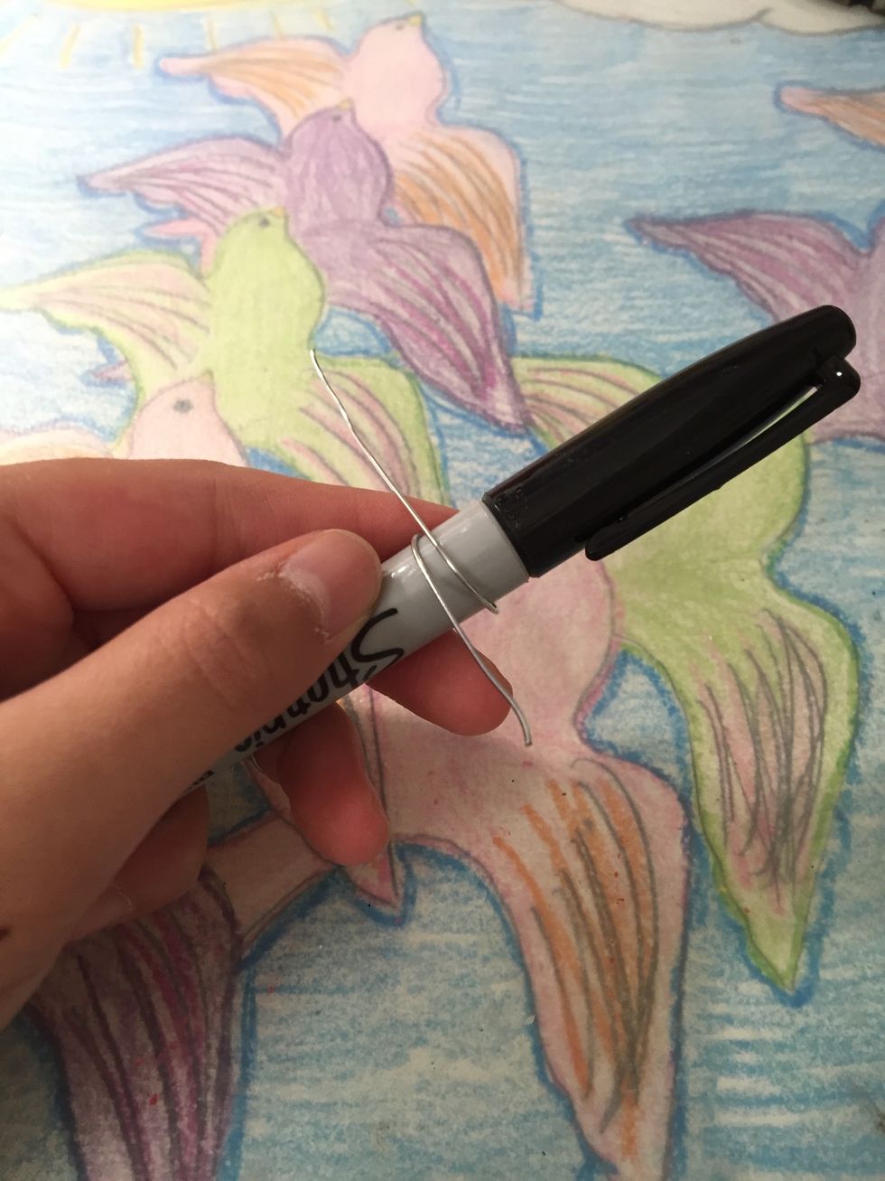 For the first ring measure about 4 to 5 inches of wire and wrap it around your marker