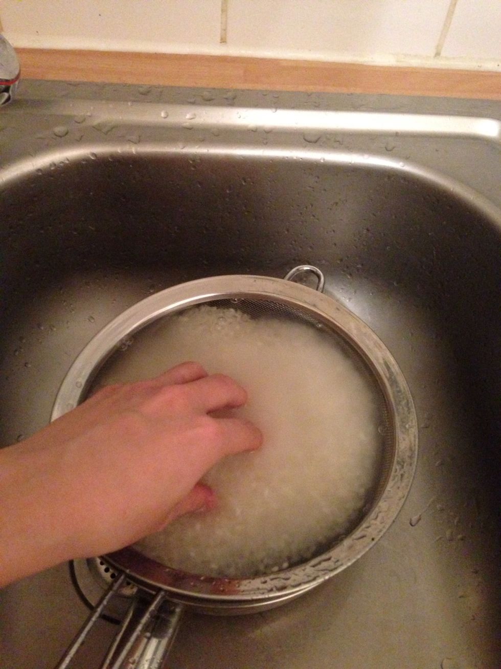 For the first rinse, stir only once and quickly lift the strainer from the water. This is to prevent the rice to soak up the smell of bran.