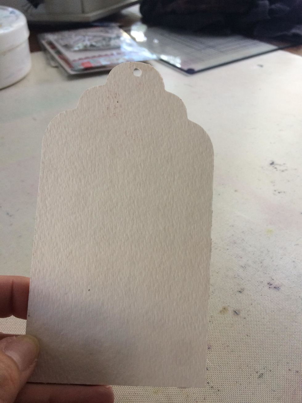 For the first step I began with a tag made of watercolor paper. I like to use Watercolor paper because it absorbs the product so much better than paper that had a gloss finish.