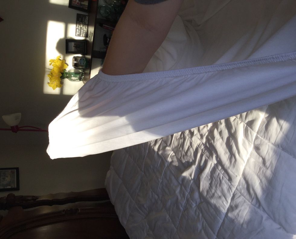 For the fitted sheet put your hand on top of the sheet to slide it inside the corner crease