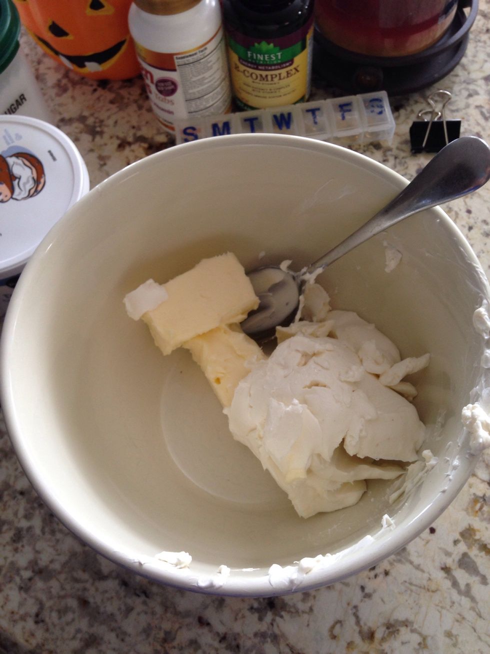 For the frosting: In a medium bowl, combine 1/2 butter and 8 ounces of cream cheese.