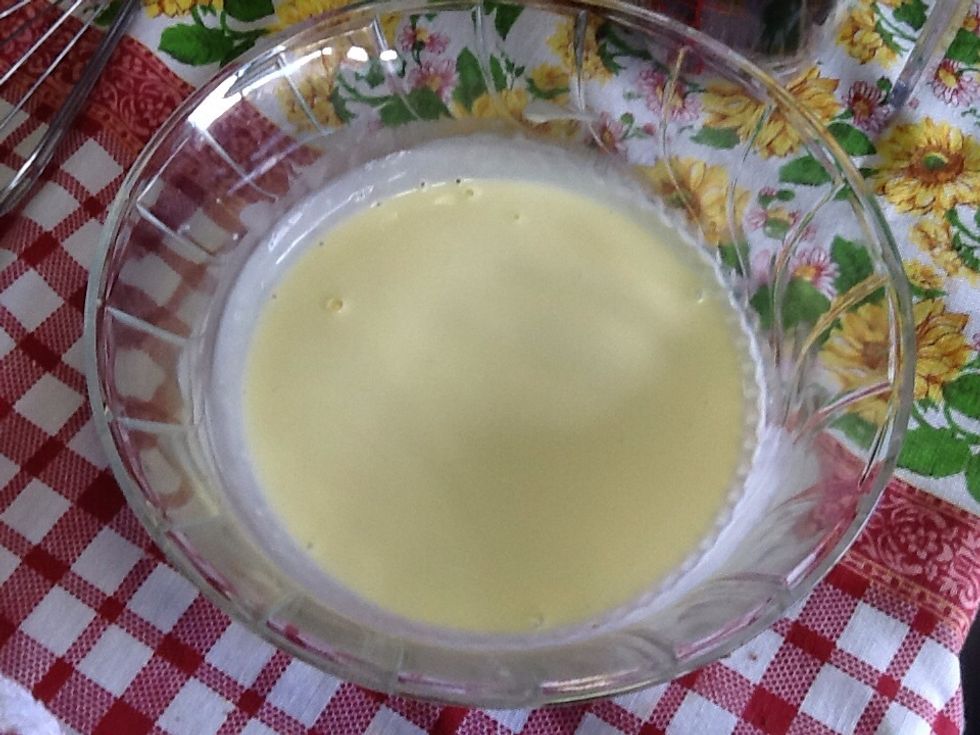 For the glaze, heat the cream and vanilla extract in the microwave until bubbly and warm.