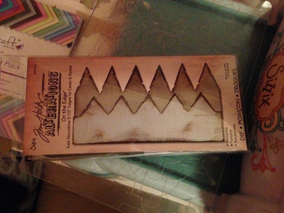 for the grass i used a Tim Holtz die alterations on the edge pennants