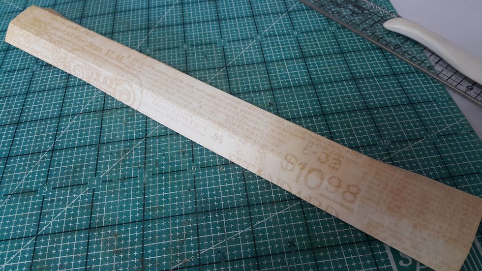 For the handle, cut paper 1-1/2"x12", score and fold 3/8" each side and adhere