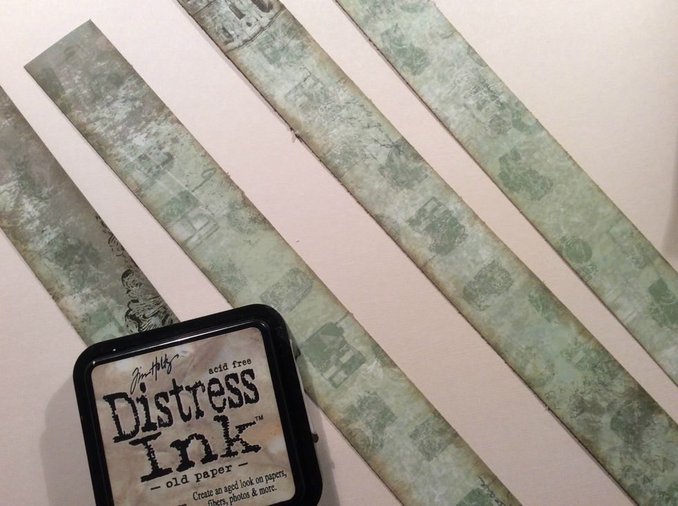 For the inside of the frame I gathered a color of paper that would blend with the other colors of my project. Cut in strips and distressed the edges with Old Paper DI. Glue to inside of frame.