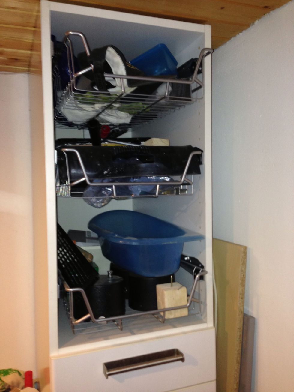 For the large cabinet, a door was missing, so we added metal baskets in there.