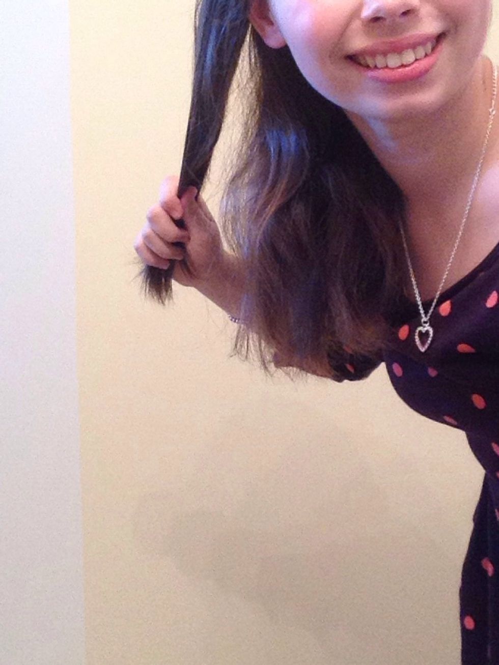 For the last hairstyle, start out by gathering your hair to one side and picking up an one inch section of hair.