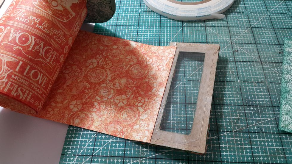 For the last panel, adhere acetate on the back, then adhere on the end of the scroll album. Cover both sides of the panel with papers of the same size.