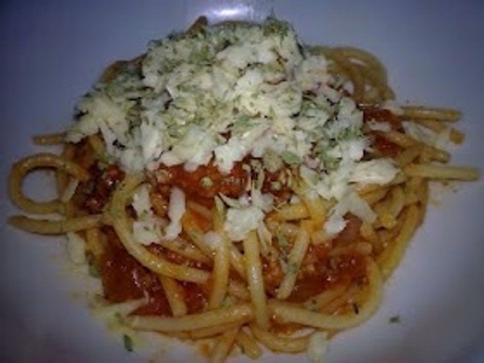 For the last step, sprinkle the shredded Cheese on top of your Spaghetti. Enjoy :)