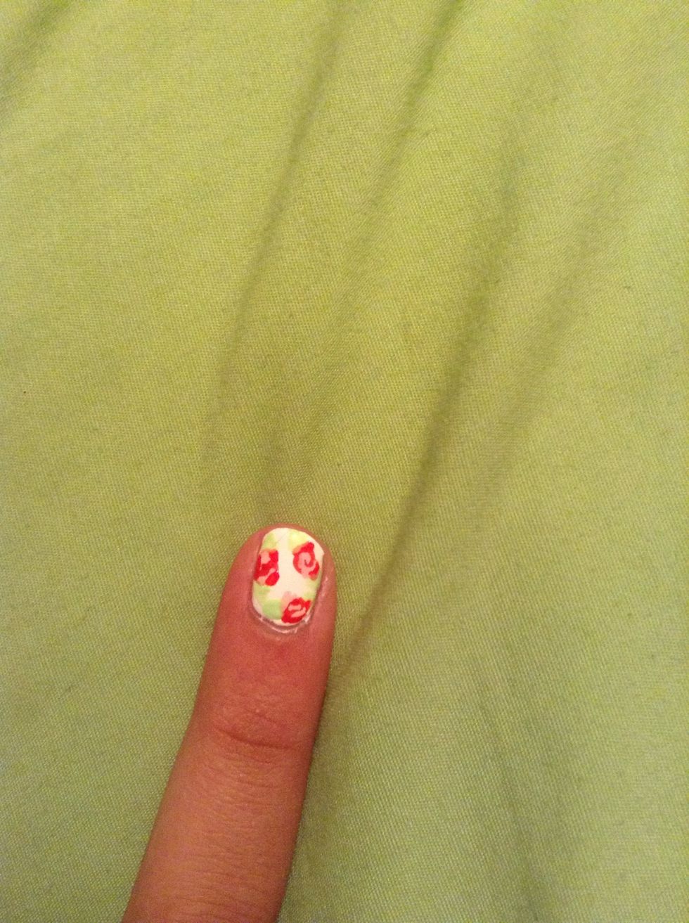 For the leafs take a light green and make a triangular shape on both sides of your flowers.