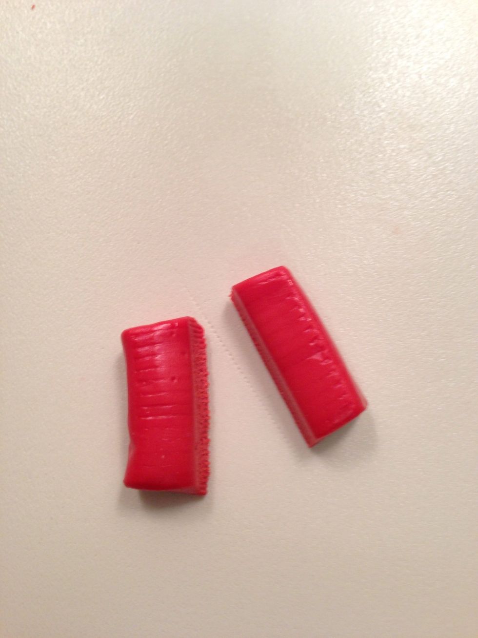 For the lipstick, cut your red candy in half.