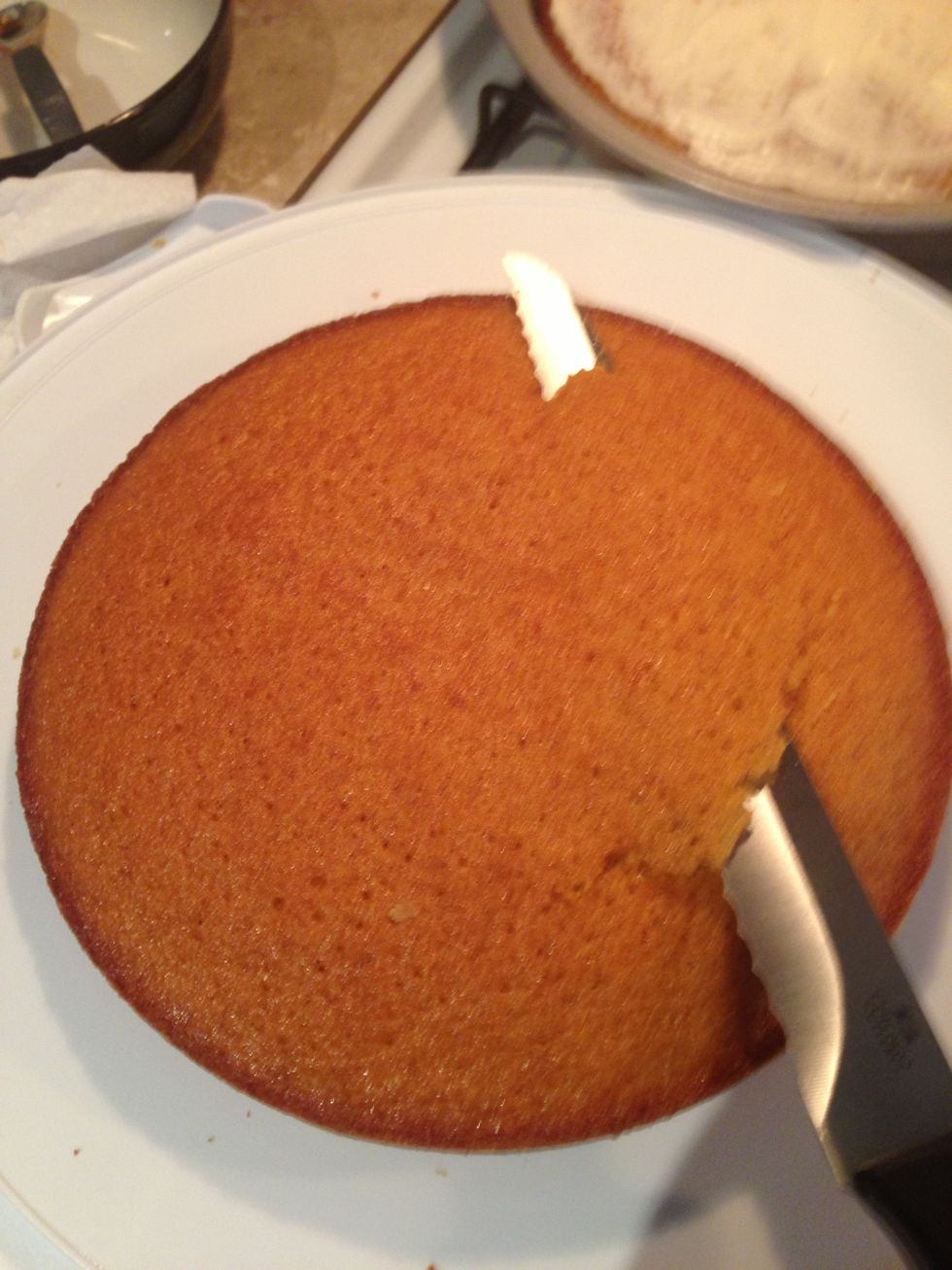 For the next layer, do the same as the first, and carve the cake surface to make it flat too.