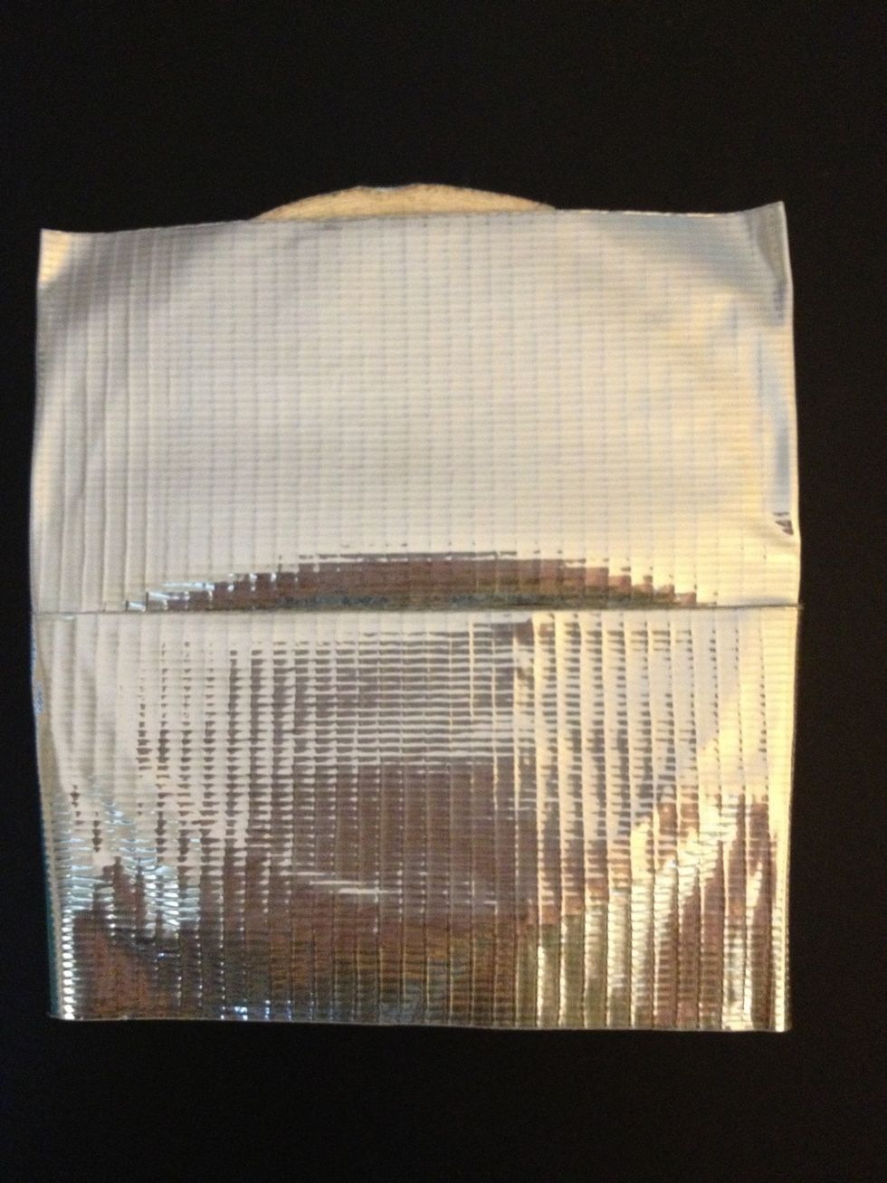 For the next piece, cut another strip the same length. Line it up with the edge of the last piece and wrap it around. Repeat until you reach the top of your shape.