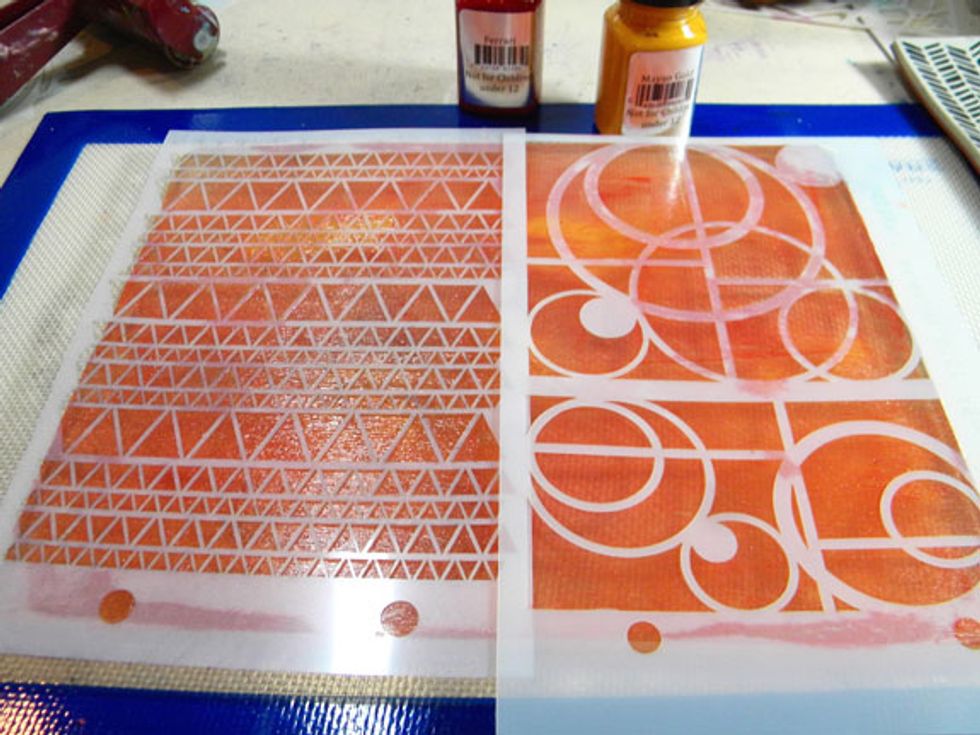 For the next print, I cleaned off the Plate with a baby wipe and added Ferrari and Mayan Gold.  I placed the triangle and circle stencils down onto the plate and then removed them.