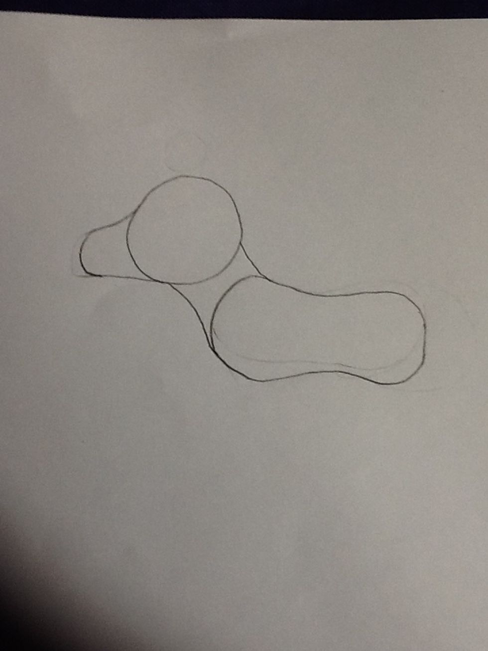 For the next step, connect the head to the corners of the baked bean and draw a snout shape, sloping from the head. Easy so far, right?
