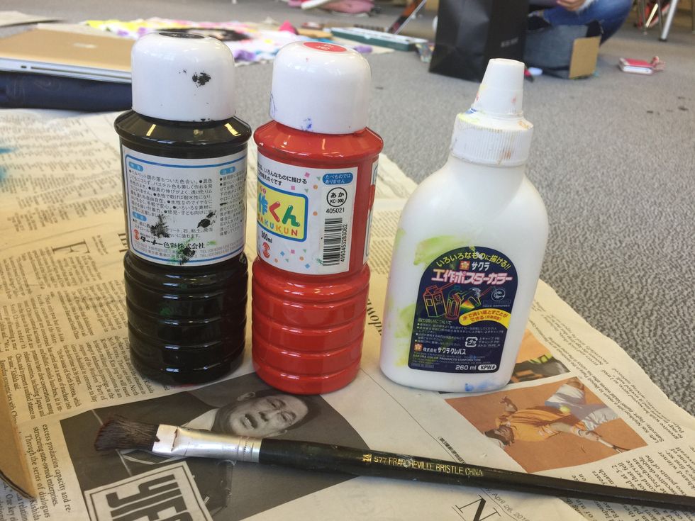 For the next step, gather red and white paint.