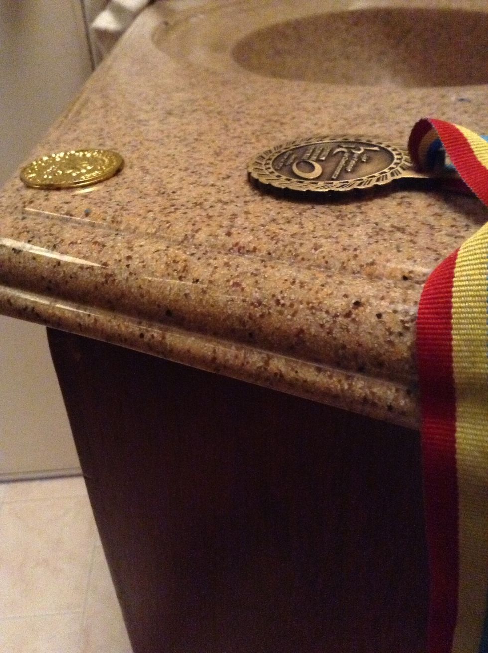 For the next step you can use either a medal or a plastic coin or whatever gold painted stuff you have