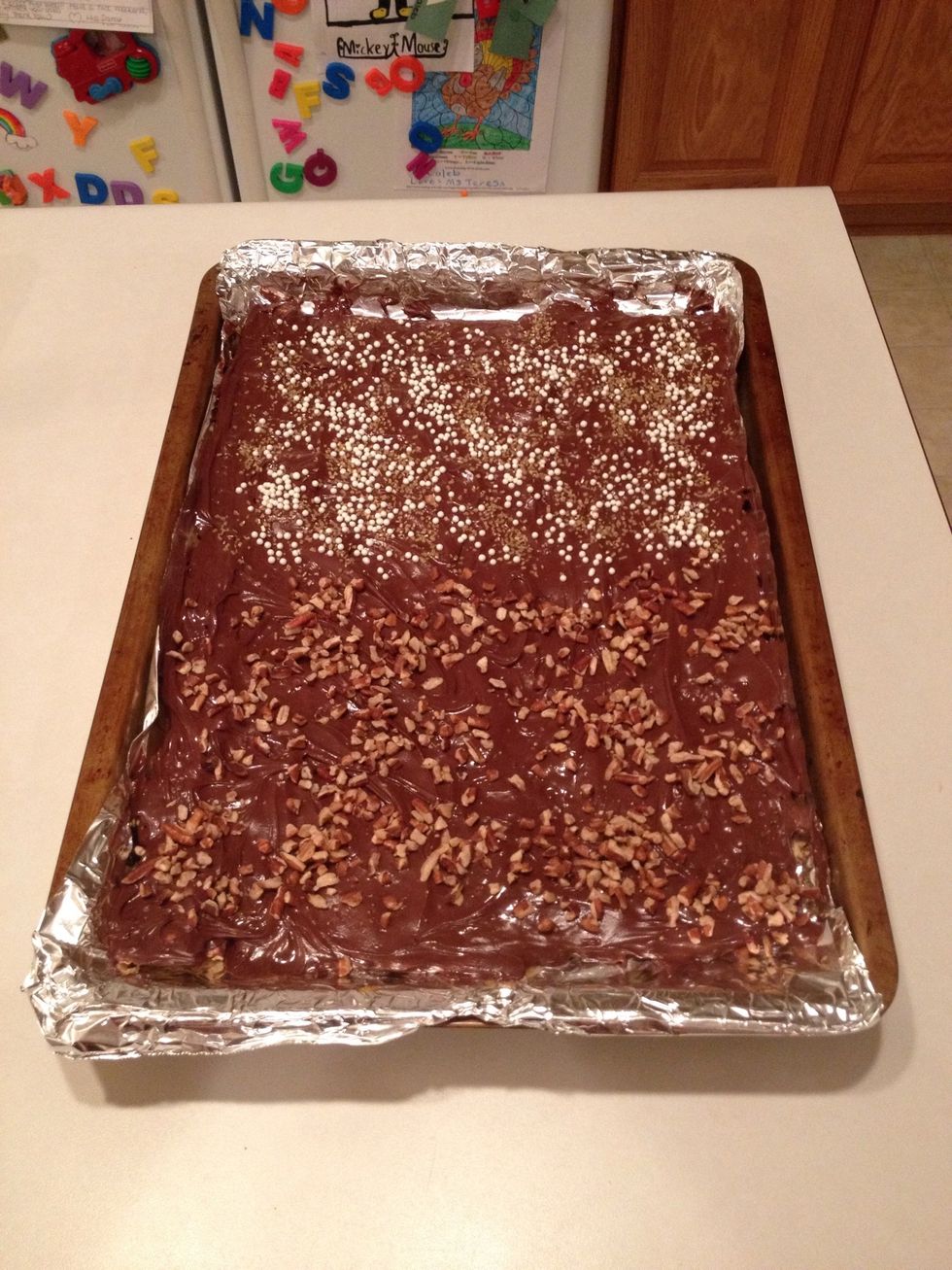 For the other half I used pecan chips. No matter what you decide to use, sprinkle your topping evenly over the chocolate. Place in the refrigerator until chocolate hardens.