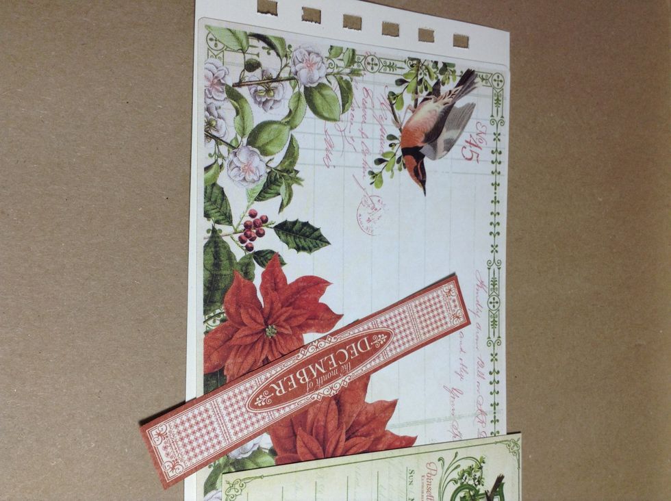 For the pages, prepare and cut 12 pieces of 10 1/2" x 4" white cardstock. I have used the extra blank sheet of paper at the back of the 12x12 paper pad!