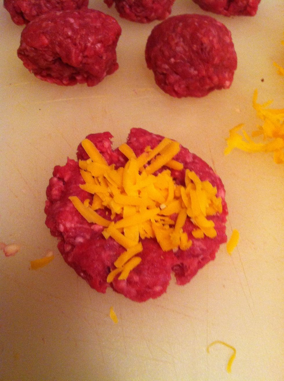 For the patties to which you're adding cheese, make sure you flatten the ball out enough to get the cheese inside...
