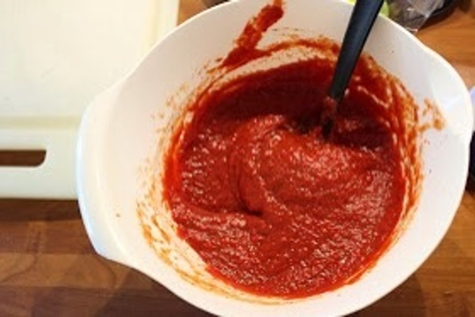 For the sauce, add tomato puree, 4 cups of water and salt, pepper and chilipepper.