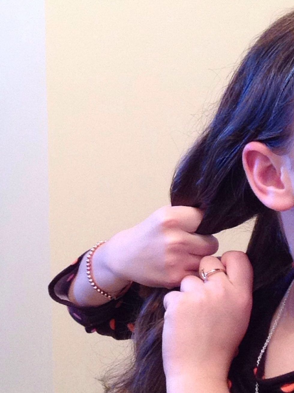 For the second hairstyle, start out by separating your hair into 3 sections.