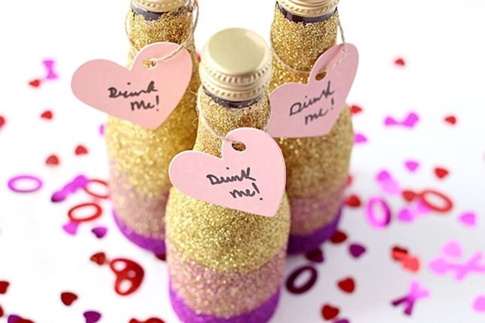For the tags, I bought the heart embellishments at Michaels. I hole punched the hearts and scribbled "Drink Me" on them. I tied the tags to the bottles with twine.