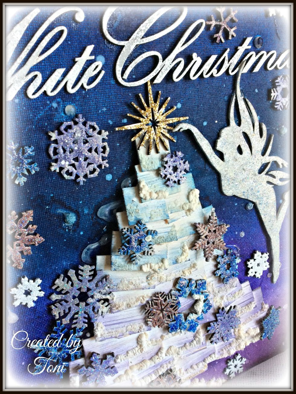 For the title I used Winter Wonderland embossing powder. It's opaque with sparkles.