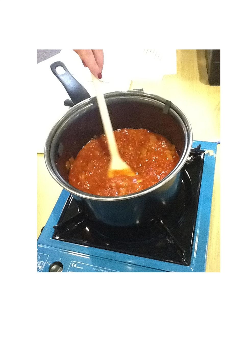 For the tomato sauce, in a sauce pan add some oil, a diced onion with a crushed clove of garlic, and two tins tomatoes. Allow to simmer for 30 minutes. Add salt and back pepper to taste.