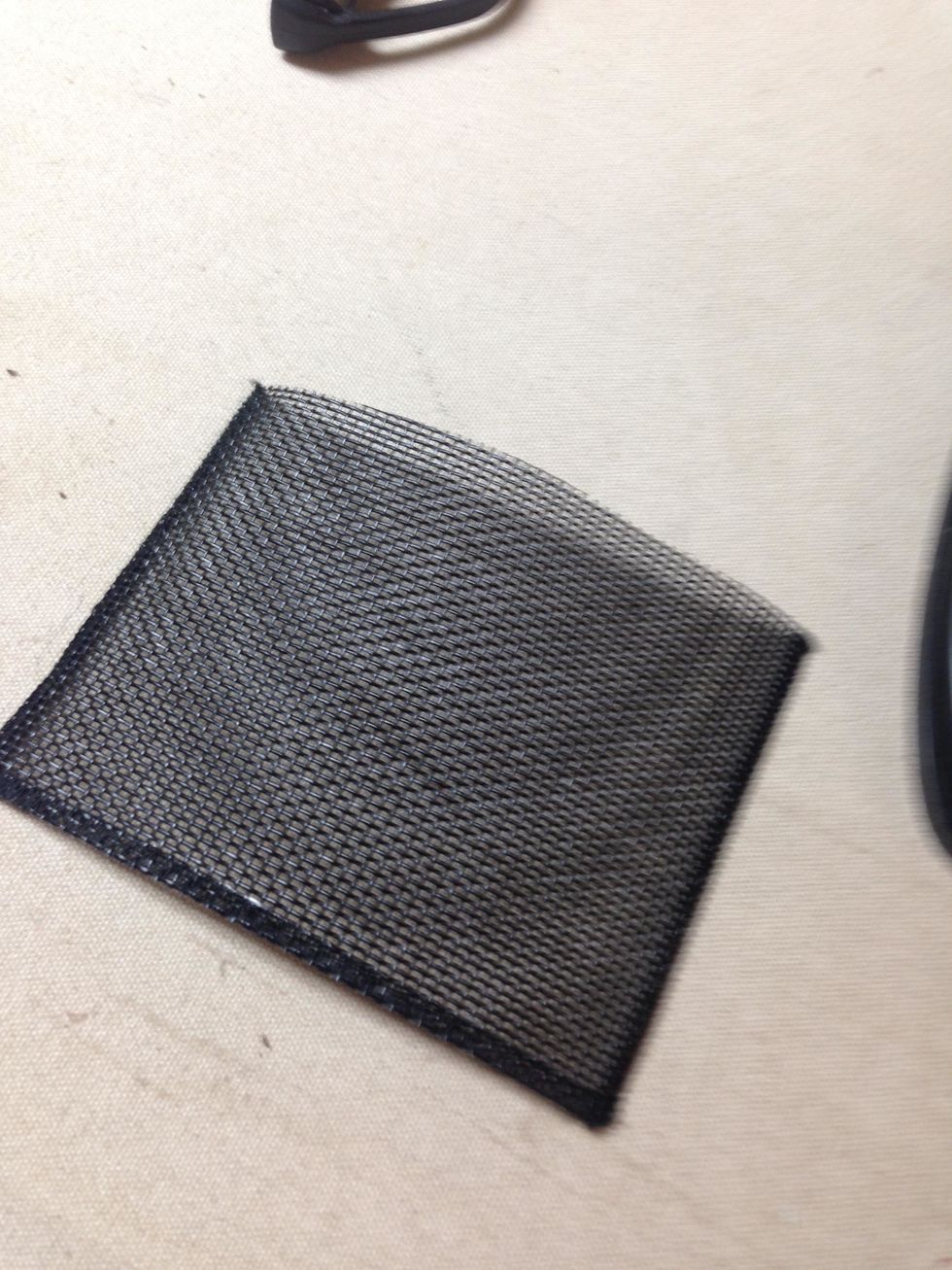 For the utensil pocket, I happened to have black wooly thread in my serger  to do rolled hems so I serged the sides and bottom of my pocket which finished the edge nicely - but this is not necessary.)