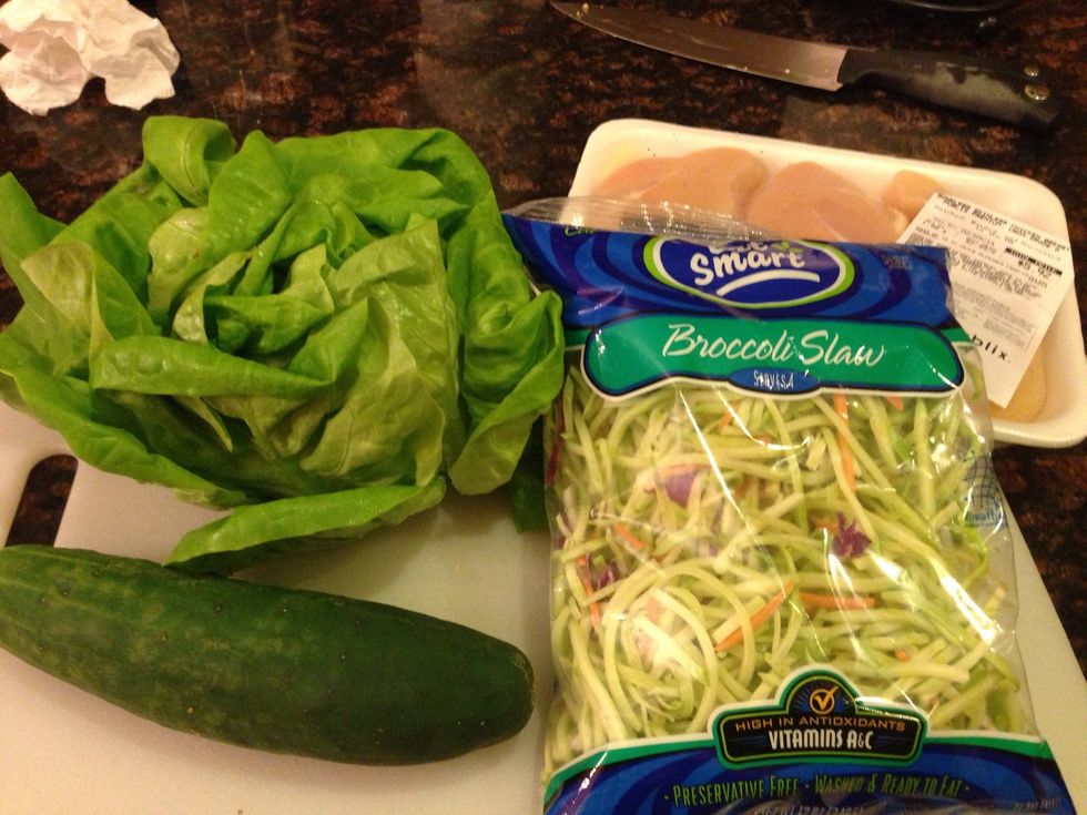 For the wraps you will need chicken breasts, a cucumber, a head of lettuce, and broccoli slaw.