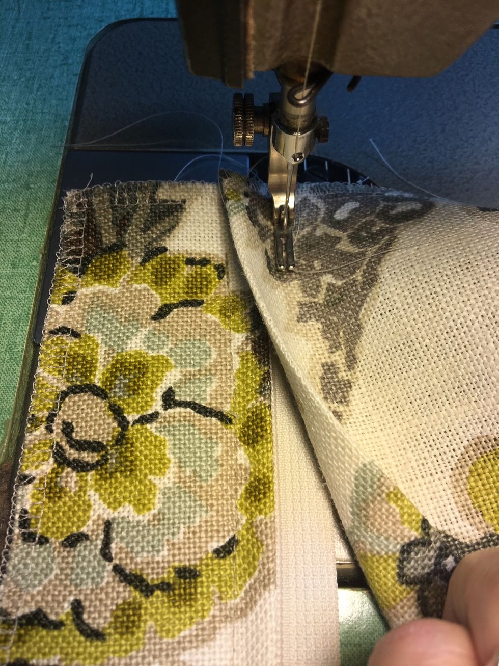 For the Zipper version: Place PILLOW BACK, folded edge on top of the other side of the zipper - overlapping to the previous stitch line as shown.  Stitch from edge to edge of pillow.