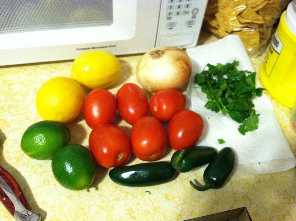 For this batch of salsa I used 3 tomatoes, 1/4 of the onion, handful of cilantro, 2 1/2 jalape\u00f1os, 2 lemons, and 3/4 of a lime.