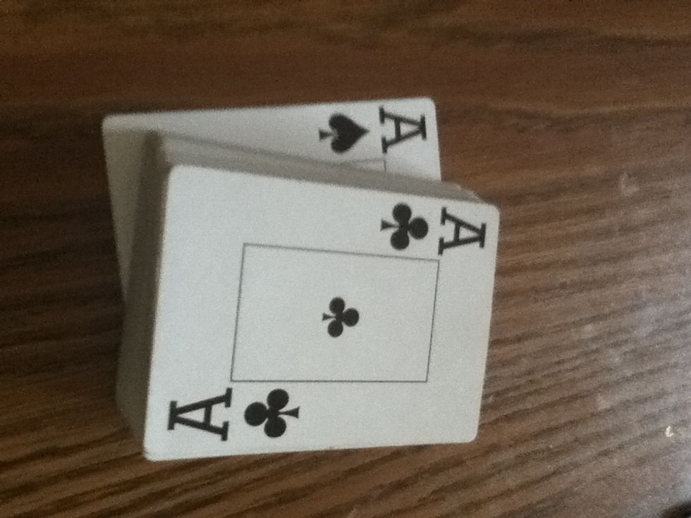 For this example I will use the ace of spades on top and the ace of clubs on bottom.